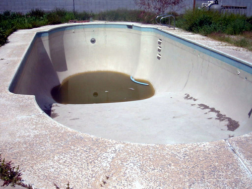 An eyesore and a hazard - an abandoned pool